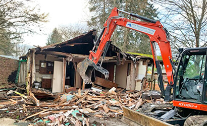 Apex demolishing a structure for the city or county